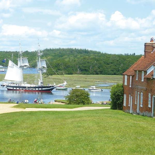 Bucklers Hard (Dorking Route) Bucklers Hard with sailing ship on river